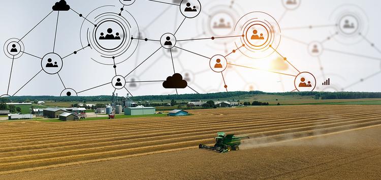 Aerial view of a wheat field being harvested with farm in the background and the sky replaced with icon graphics representing knowledge translation.
