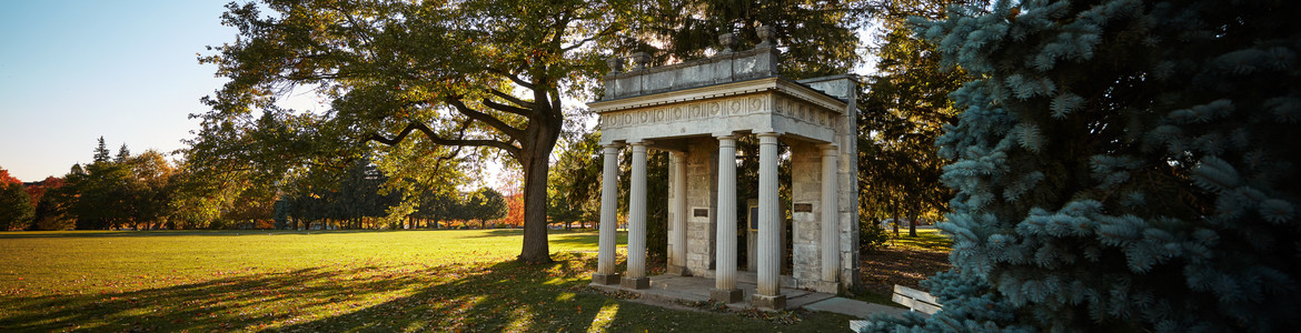 The Portico surrounded by lawn and trees
