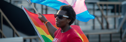 Student holding the transgender flag