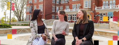 Three people sitting at the fountain in Lang Plaza.