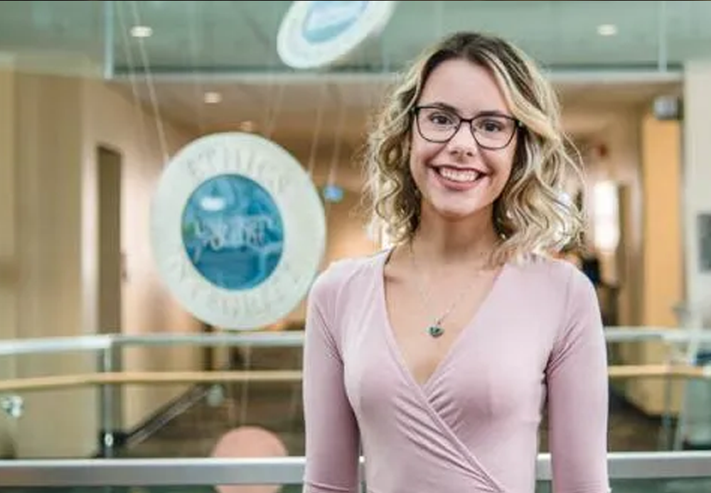 marketing student photo standing in mac hall