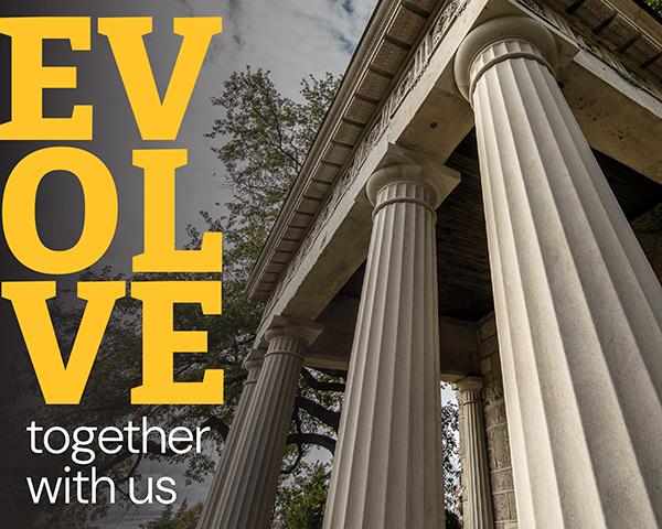 Closeup of the portico with text that reads: Evolve together with us.