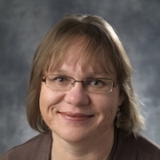 Profile photo of Dr. Rebecca Hallett, wearing glasses and smiling