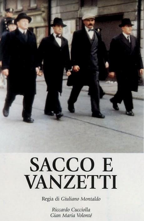 Official poster of the movie with four men in long black coats and hats