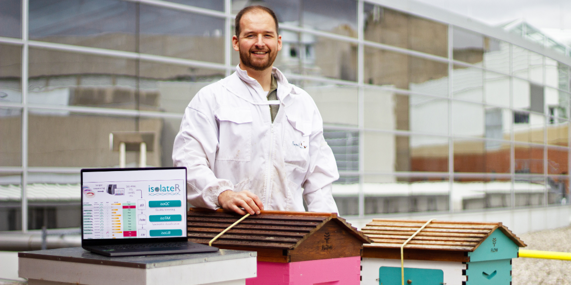 Brendan Daisley on the roof with beehives