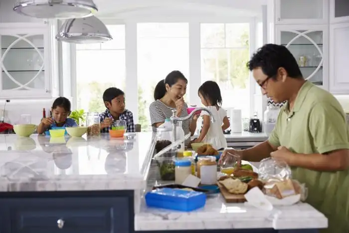 family making lunch