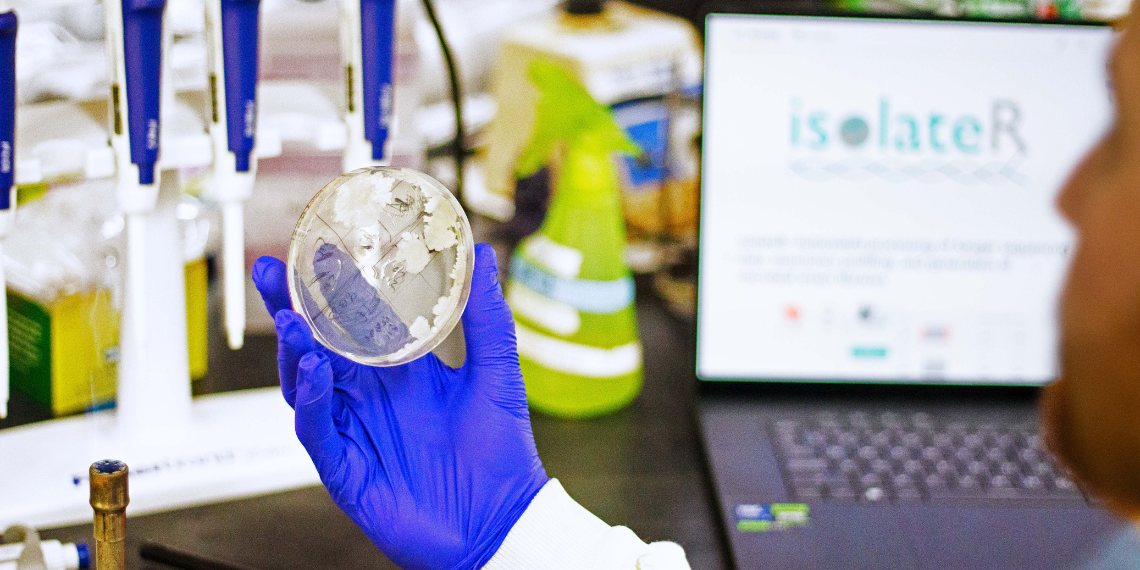 Brendan Daisley looking at a petri dish