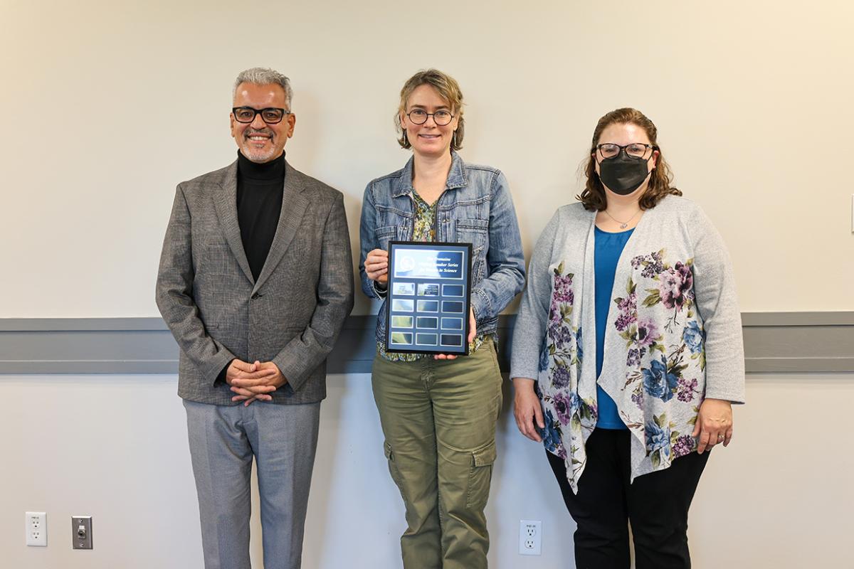 Group photo of Drs. Moncef Nehdi, Joanna McGrenere holding a plaque for her role as this year's speaker, and Stacey Scott.