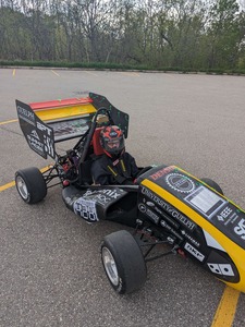 Matthew test driving a car.