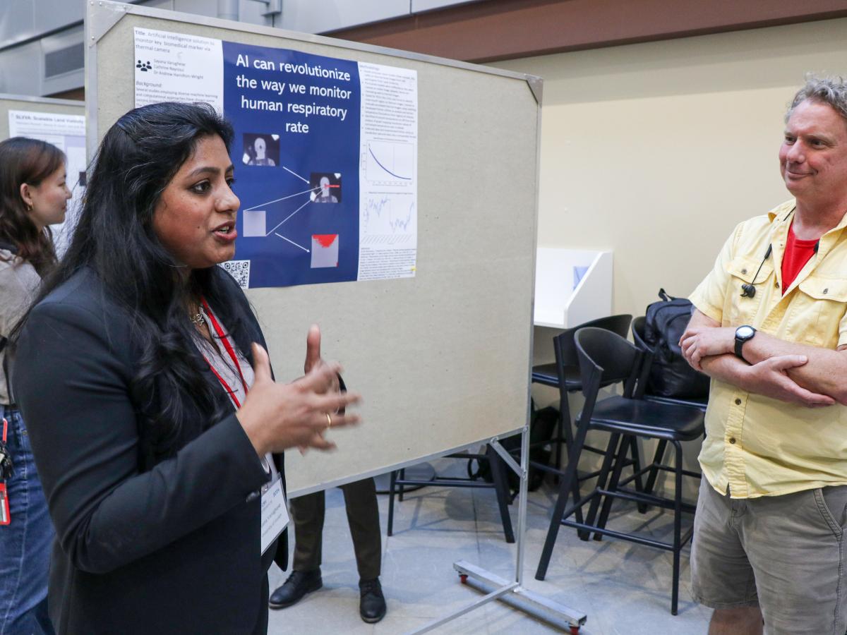 Master’s student Sayana Varughese and supervisor Dr. Andrew Hamilton presenting poster