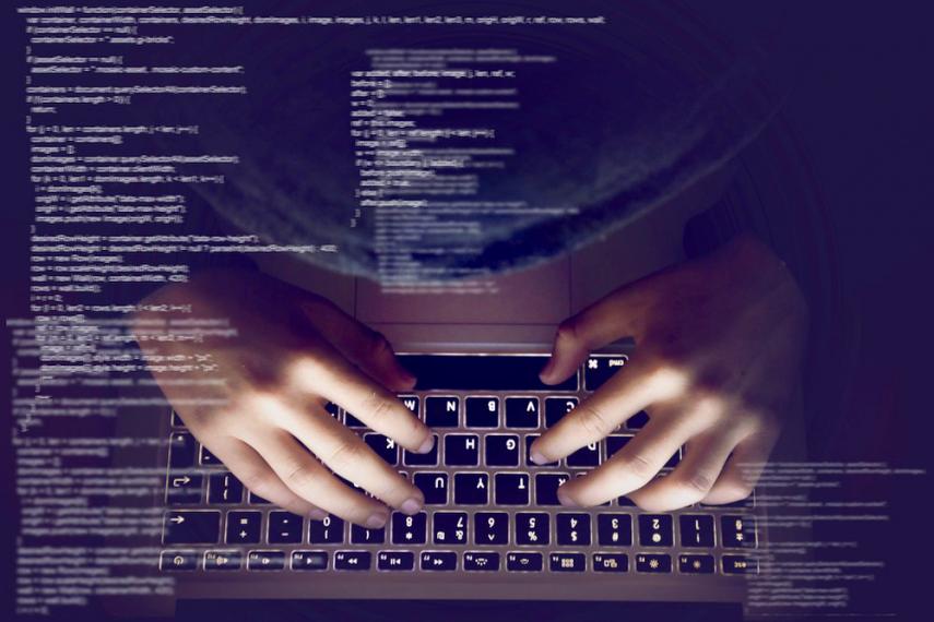 Composite image of person typing on keyboard with miscellaneous data overlaying image
