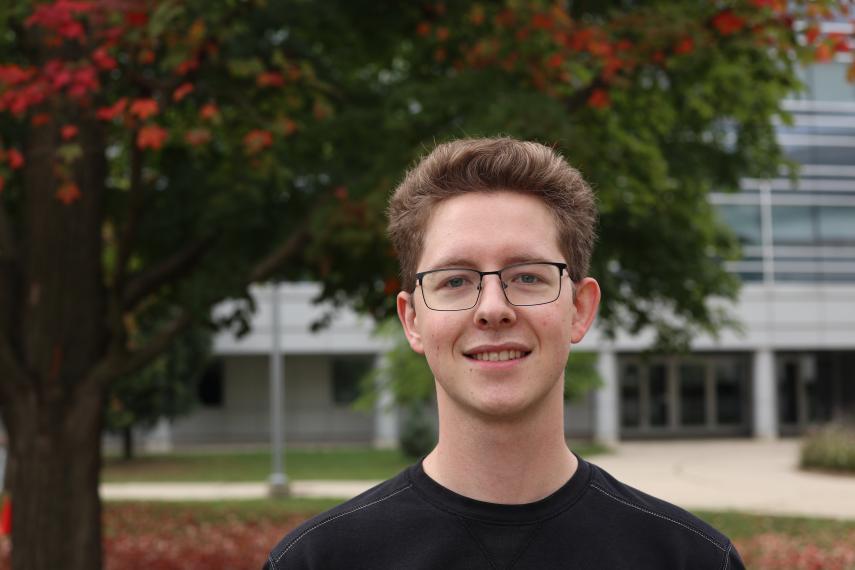 Alex Urtheil standing in front of Summerlee Science Complex.