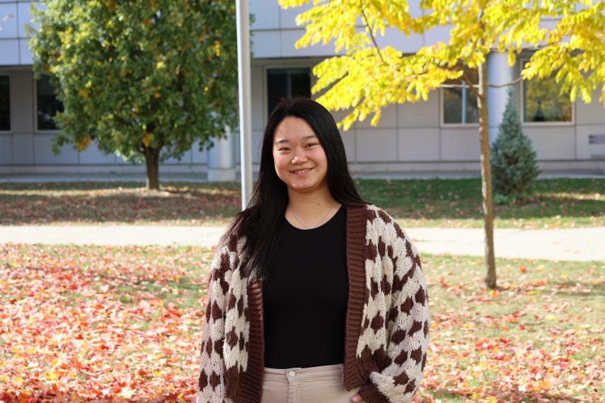 Elaine Zu standing in front of Summerlee Science Complex.