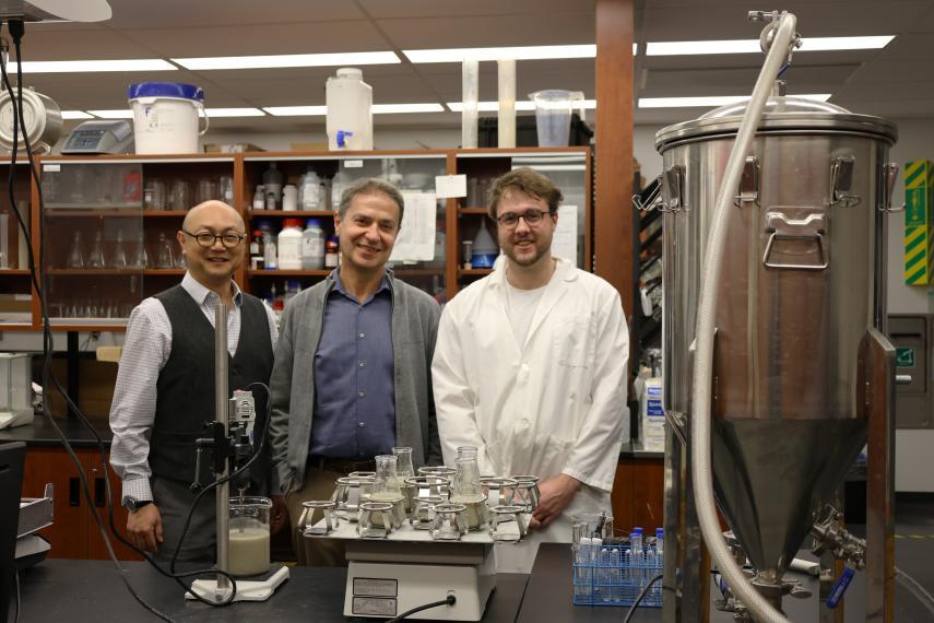 Ping Wu, Bassim Abbassi, Anthony Heebner standing in a lab.