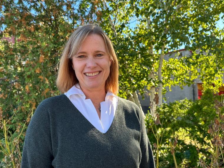 Image of Joanne O'Meara standing with trees in the background.