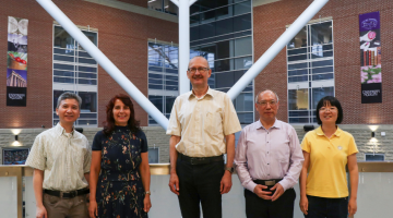 Photo of awards recipients standing side by side in Sumerlee Science Complex Atrium. Left to right: Dr. William Tam, Dr. Nagham Mohammad, Dr. Richard G. Zytner, Dr. Aicheng Che and Dr. Huiyan Li.