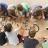 A group of campers in grades 2-3 paint a banner during a Creative Encounters Summer Camp