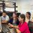 Four researchers looking at a computer.