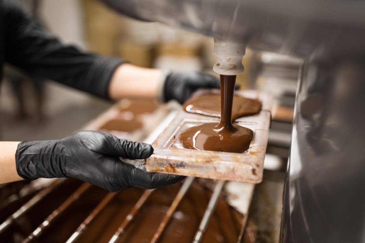 Pouring liquid chocolate into molds