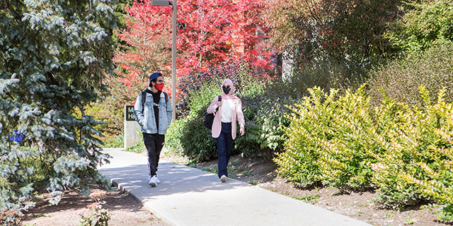 students in masks on campus