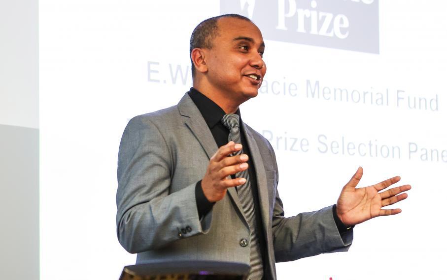 a photo of asim biswas lecturing in a classroom