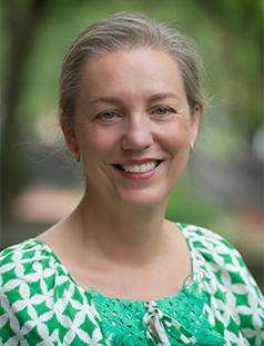 Helen Booker outside, wearing green