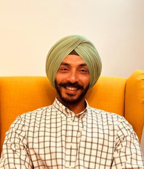 Dr. Gursahib Singh smiling for the camera.