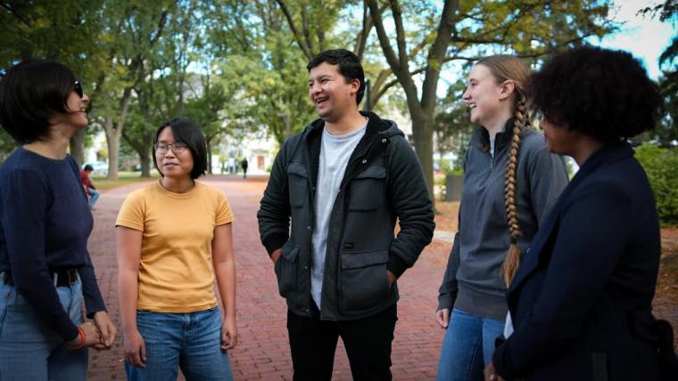 Five U of G Agricultural Economics Students happily talking. 