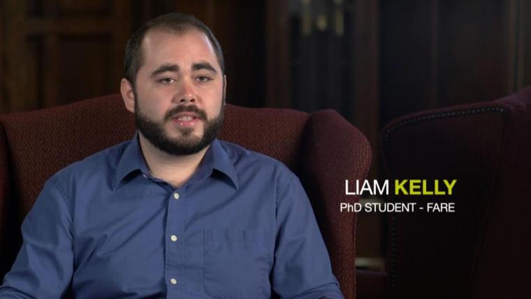 Liam Kelly sitting in arm chair with text overlay saying Liam Kelly PhD FARE student
