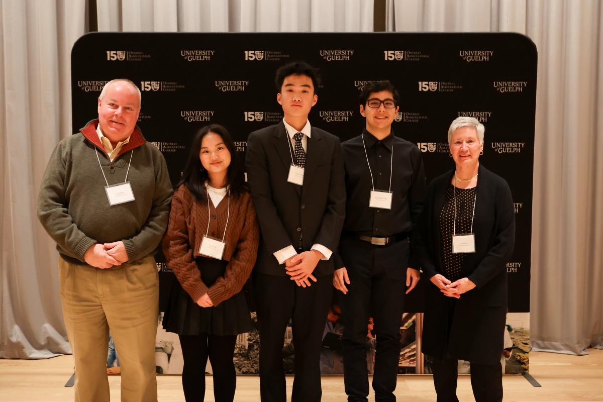 Thomas Deng posed with Andy Wilder, Lori Wilder, and other Wilder Scholarship winners.