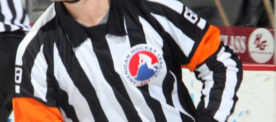 A hockey referee in action
