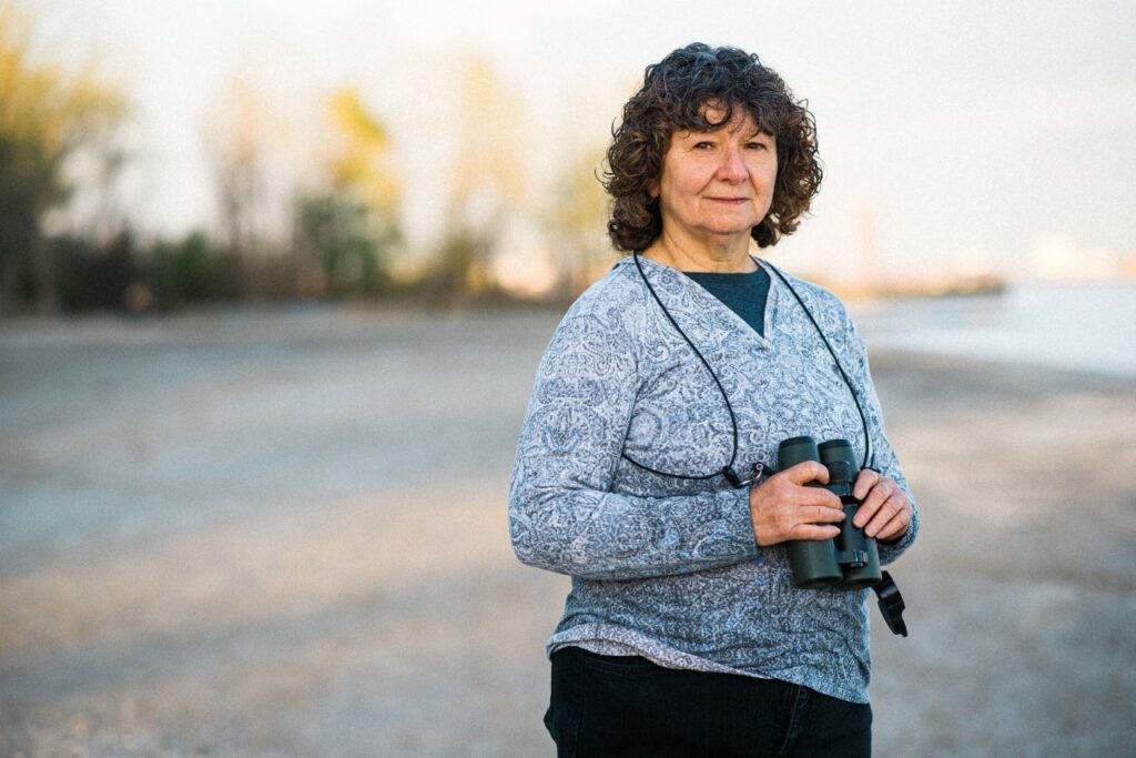 woman outdoors with binoculars