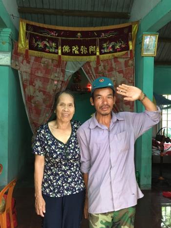 Woman and man standing inside a house in Vietnam