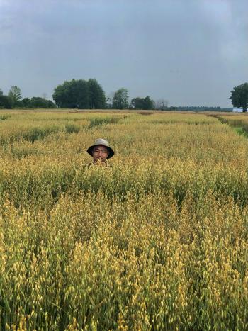A man neck deep in a wheat field.