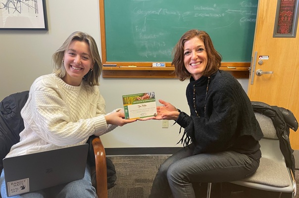 Tya Milne and Lauren Sneyd holding certificate