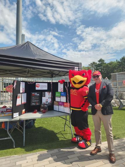 Co Chair John Walsh with the University of Guelph Mascot.